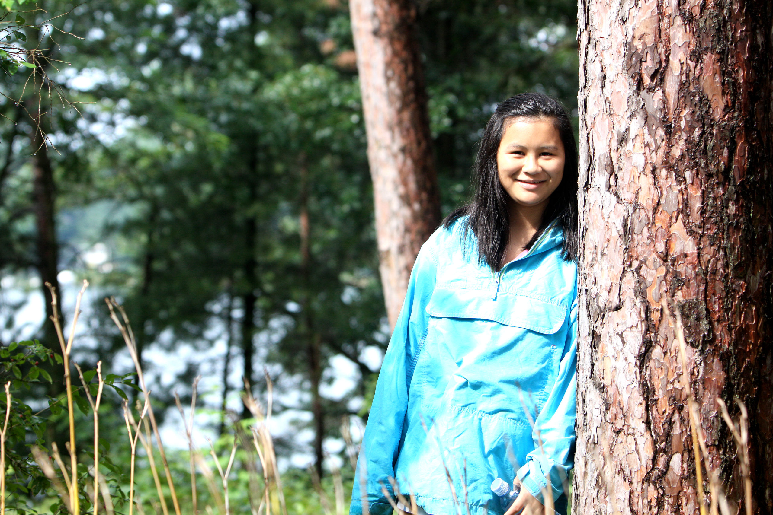 Rachel standing by tree