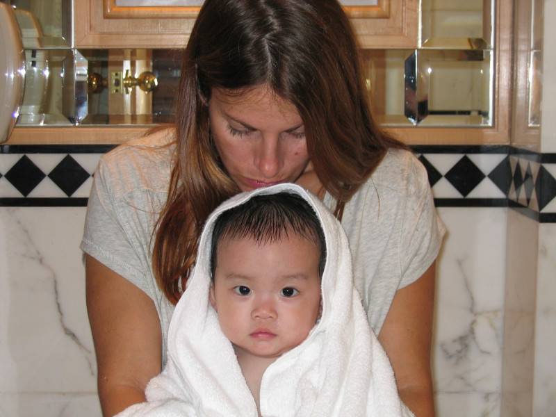 Mom with baby in a bathrobe