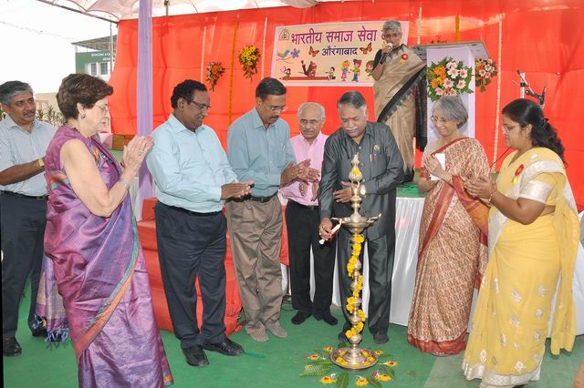 BSSK staff and local leaders inaugurate the new center with the ceremonial “lighting of the lamp.”