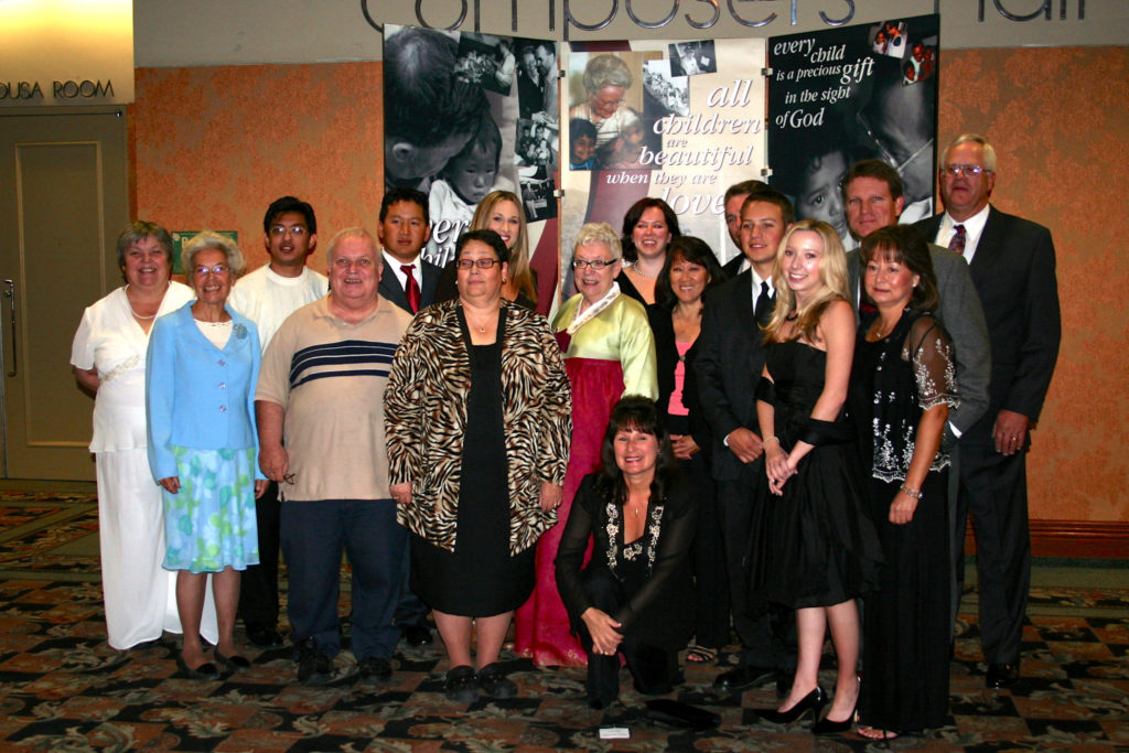 Molly surrounded by her siblings and extended family at Holt’s 50th anniversary celebration in Eugene, Oregon.