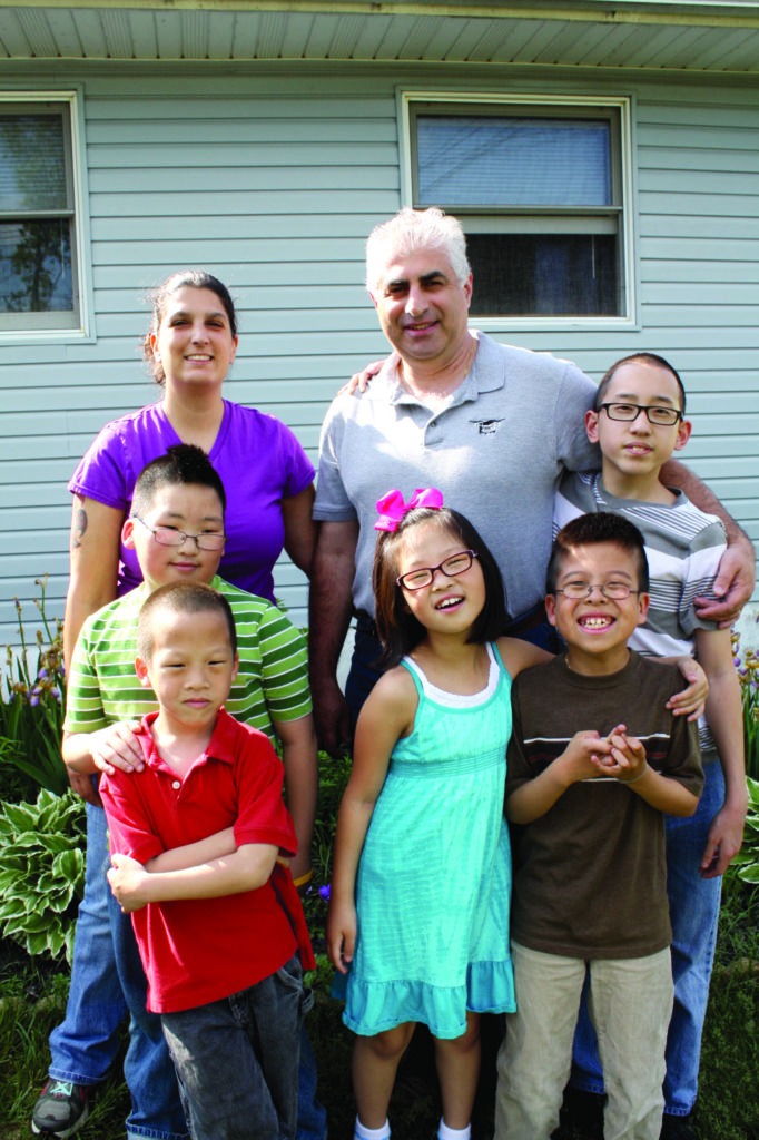 The Piu Family: Kristine and Sal with children AdamJae, 13, AidanMin, 10, AvaChae, 8, AntonYong, 10, and AndrewTae, 7 (all adopted from South Korea).