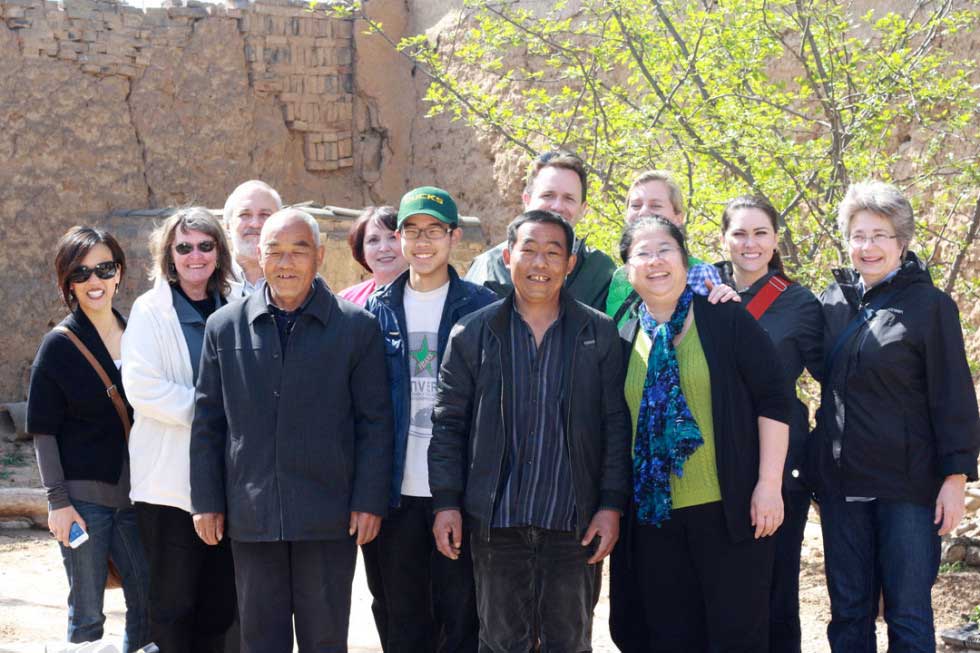 The China vision trip participants with Jian Chen (far right) and a boy whose family was affected by HIV. Holt covers his medical insurance, school fees and provides funds for a living stipend -- keeping his family stable and together.