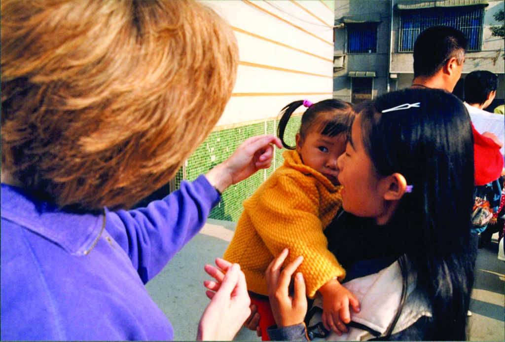 On the 2013 heritage tour of China, Grace met the woman who first handed her to her mother when she was adopted in 1999.