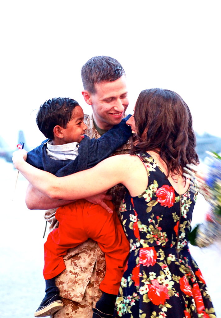 Holden and Beth Anne greet Chris upon his return from deployment.  