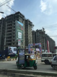 A construction project in Bangalore, India. Because Bangalore is growing rapidly, work is plentiful, so many poor families living in rural areas migrate to the city for job opportunities. However, the rapid growth is also increasing inequality, which is felt most heavily by the poor.