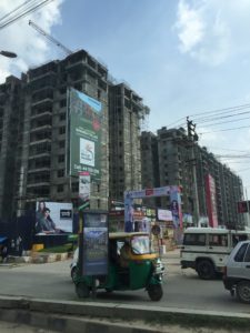 A construction project in Bangalore, India. Because Bangalore is growing rapidly, work is plentiful, so many poor families living in rural areas migrate to the city for job opportunities. However, the rapid growth is also increasing inequality, which is felt most heavily by the poor. 