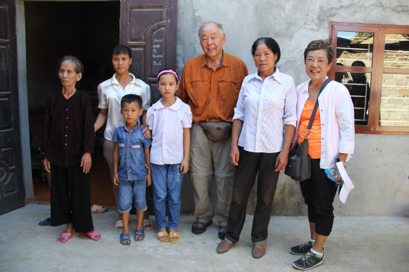Donors Ken and Diane Matsuura post with the family who received their gift