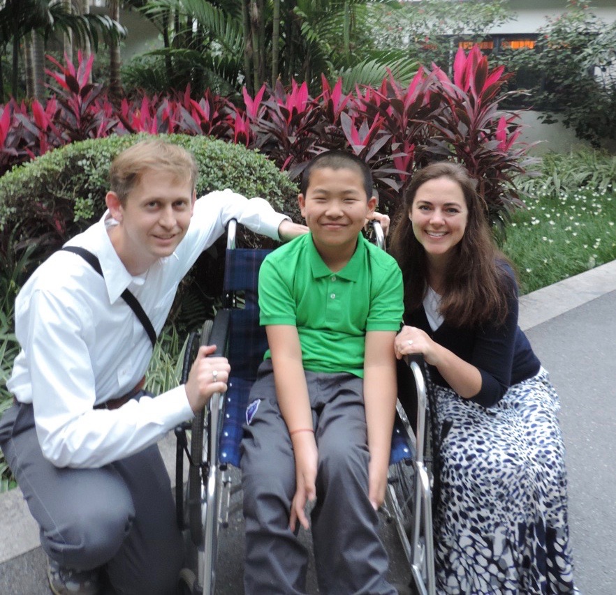 Adoptive family with son in wheelchair