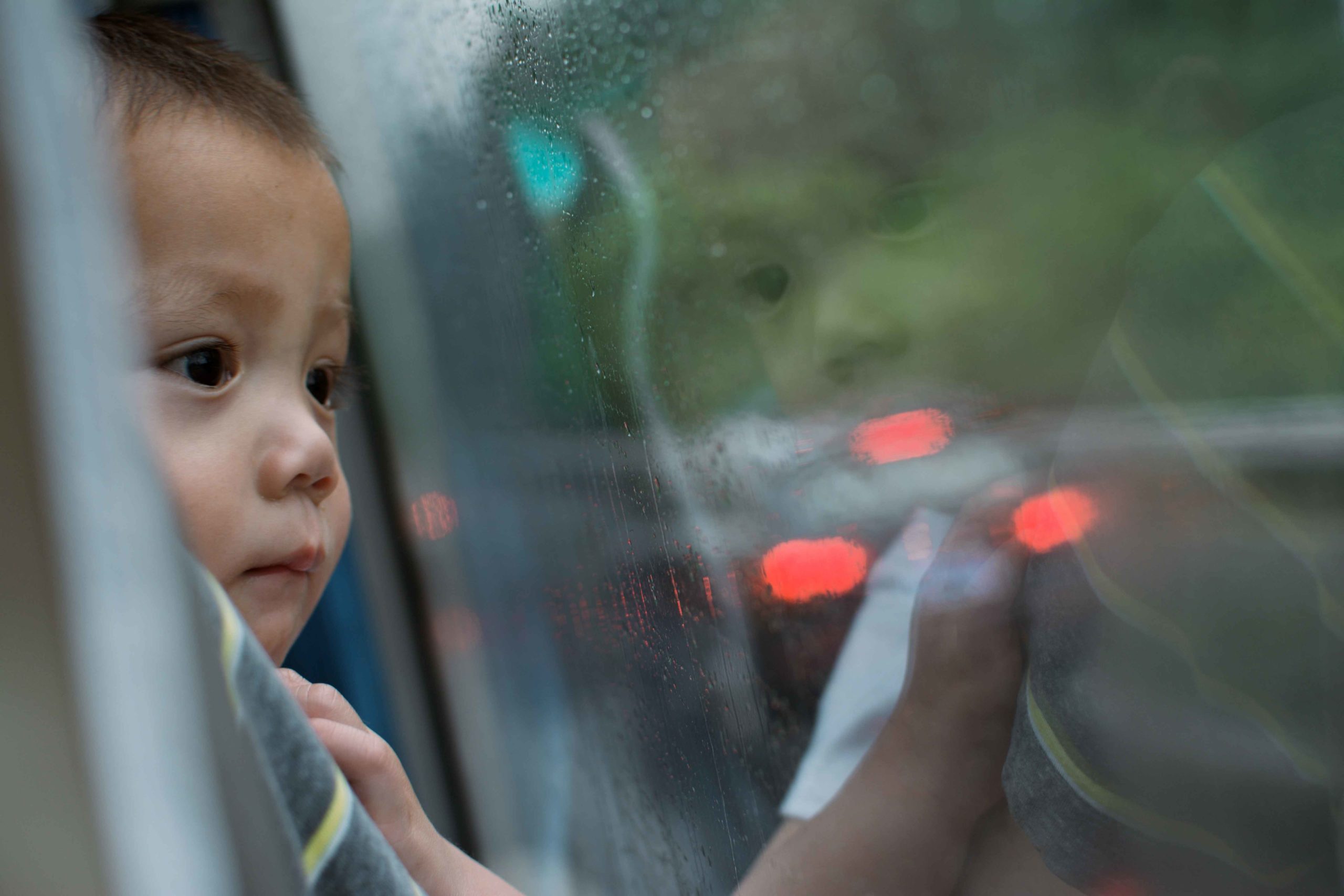 boy looking out window