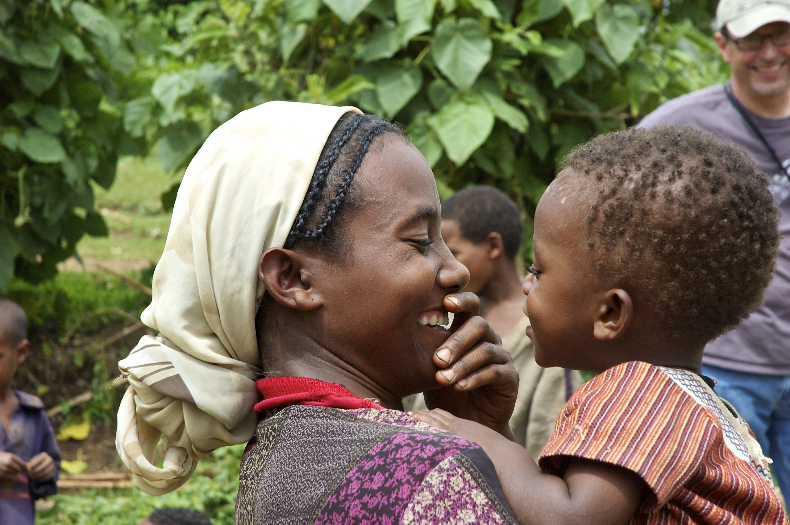 A mother and child giggle together in rural southern Ethiopia