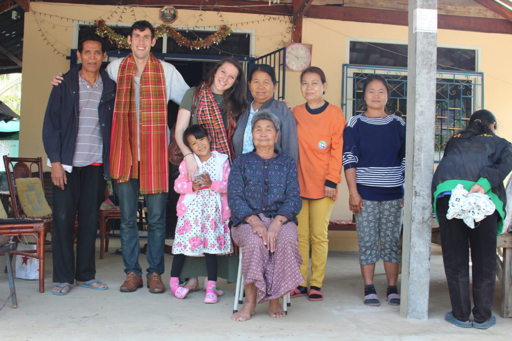 Isaac, Libby and Eden Wendland stand between Eden's foster mom and dad in Thailand.