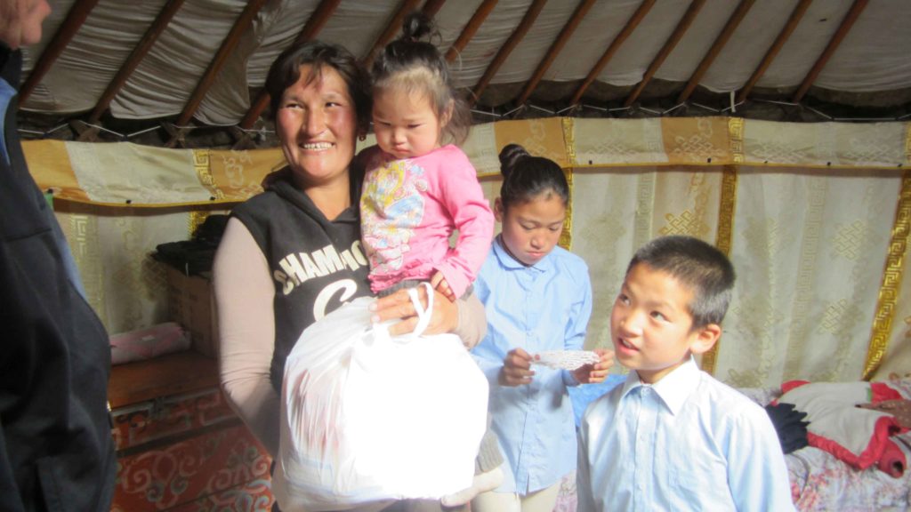“Saying this family’s life has been hard is an understatement,” Phil says. “But we are going to help them.” Holt initiated our family strengthening program in 2013. Here, Phil speaks with the family and provides them with food and supplies.