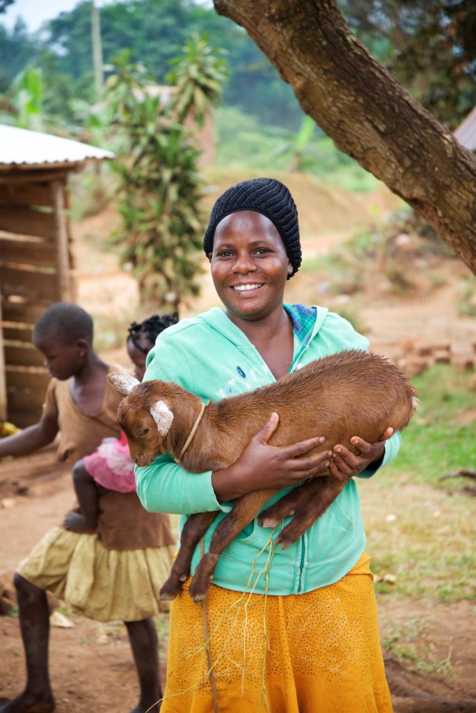 Gorret holds a baby goat she received as a Gift of Hope.