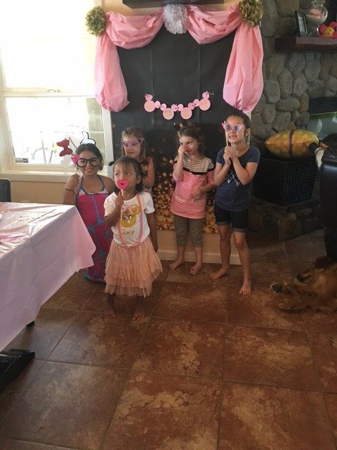 Lucy poses with friends during her 4th birthday party.