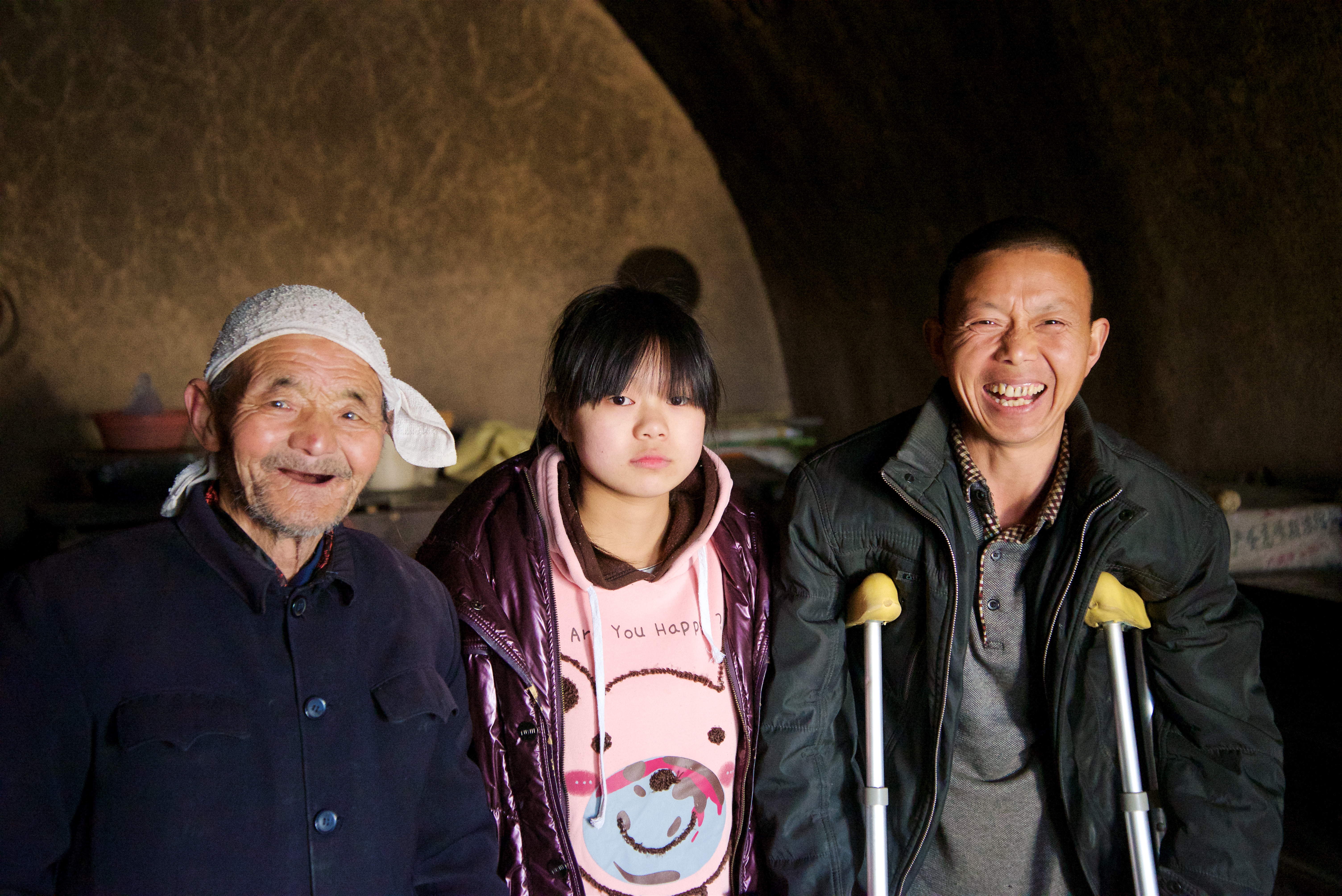 Pei posing with her father and grandfather.