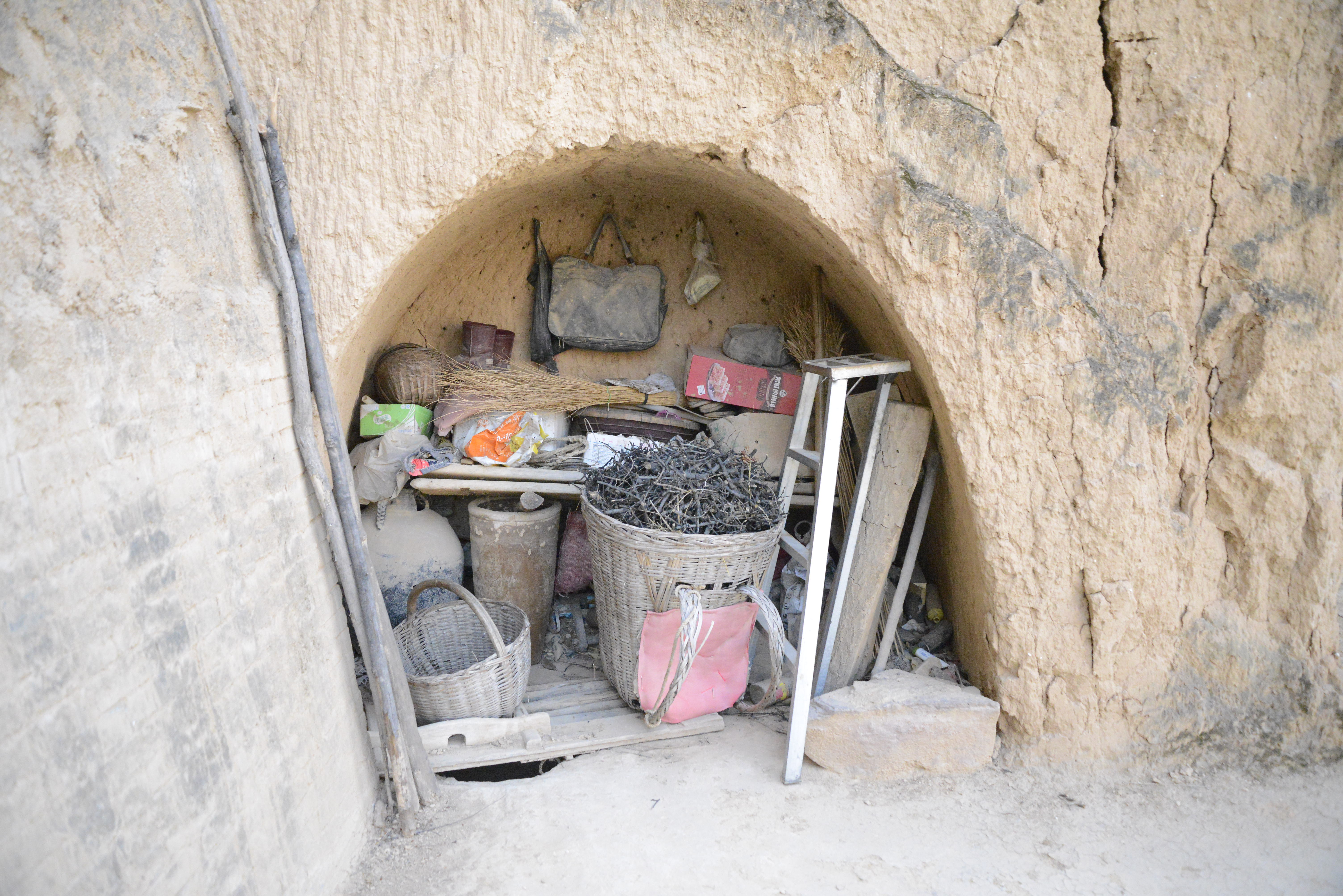 A small, carved-out storage space where Pei's family stores their supplies.