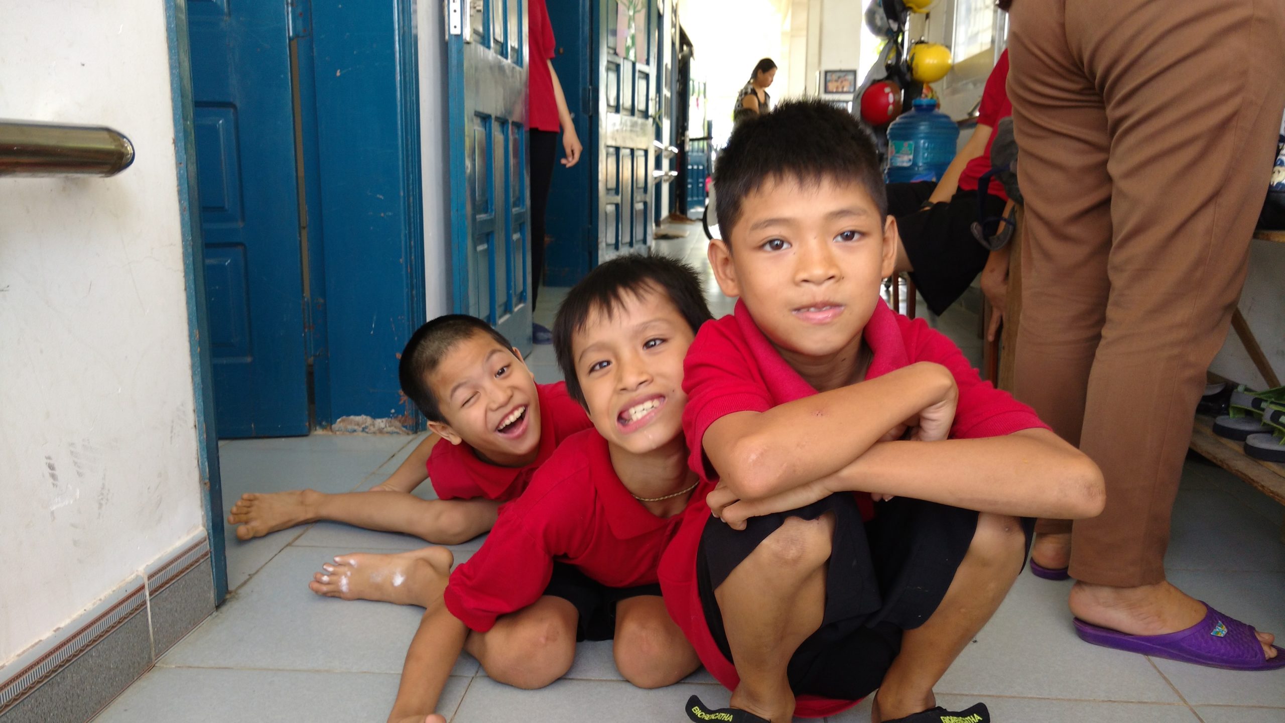 Three boys acting goofy at the Kianh Foundation