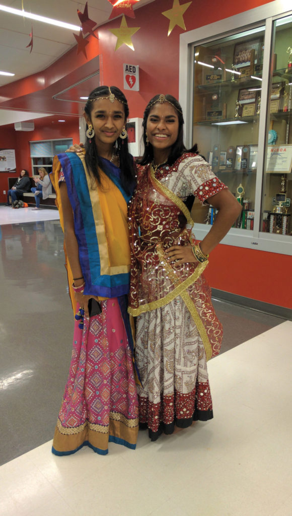 As a way of staying connected with her Indian birth culture, Malini (right) and her friend Dhruti donned saris and performed a traditional Indian dance at their school’s talent show.