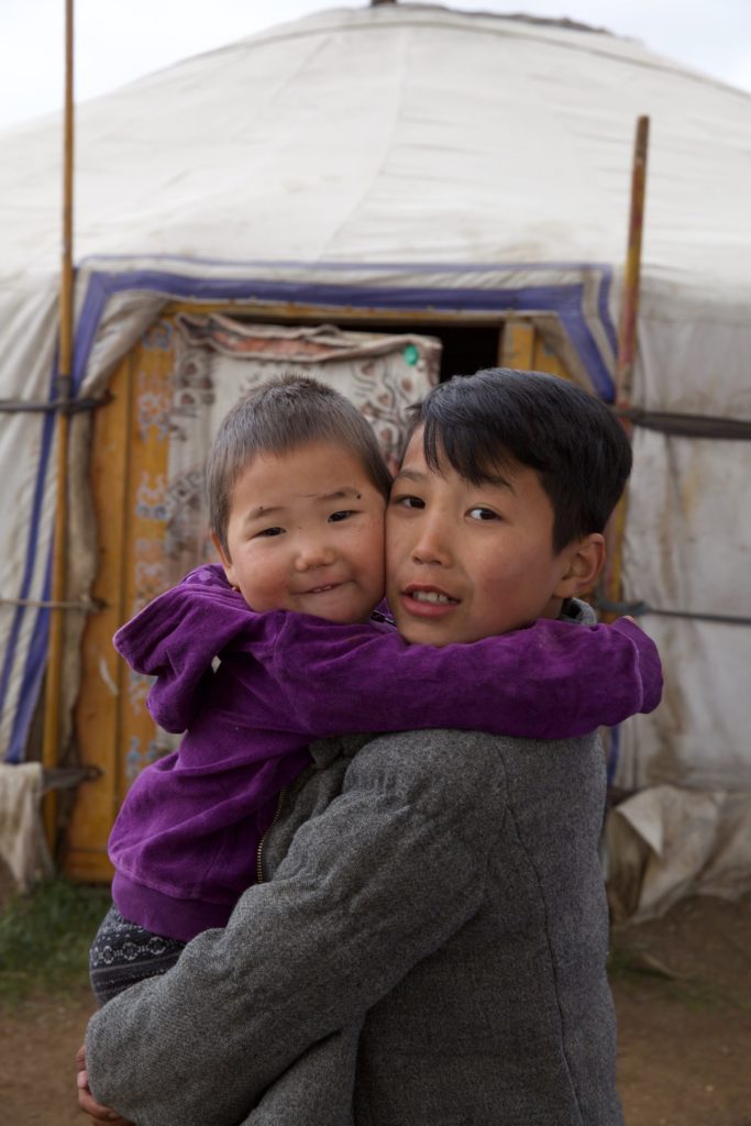 Amin-Erdene's older brother holds one of their cousins.