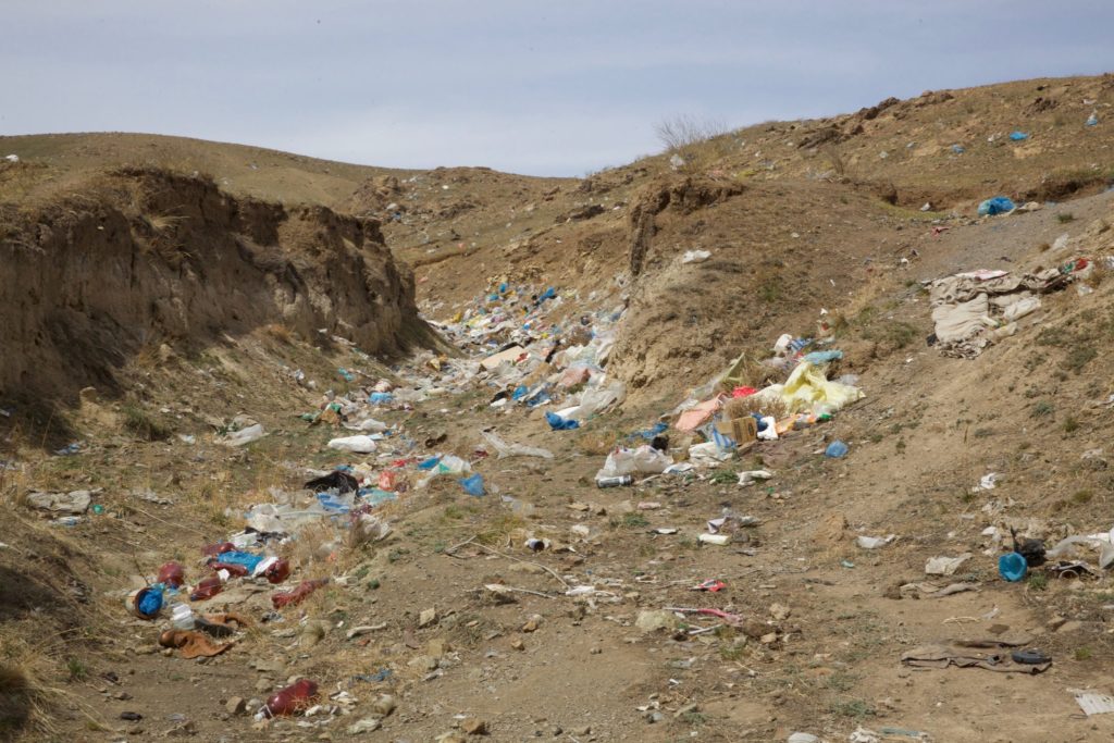 Garbage spreads over the hillsides that are home to many of the children.