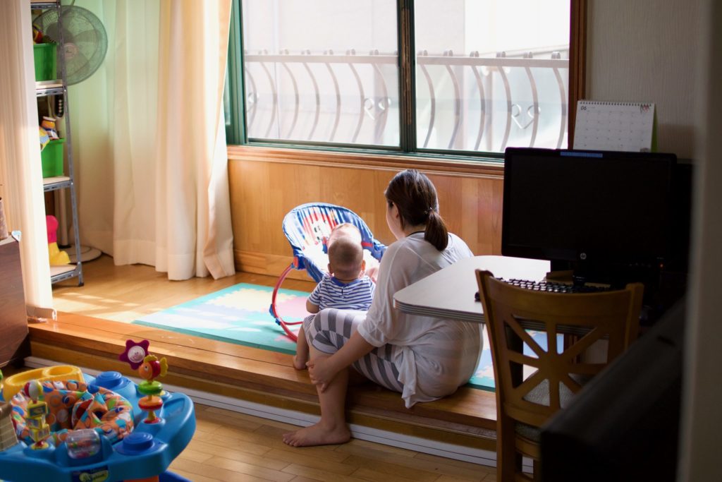 single mother in Korea playing with her child