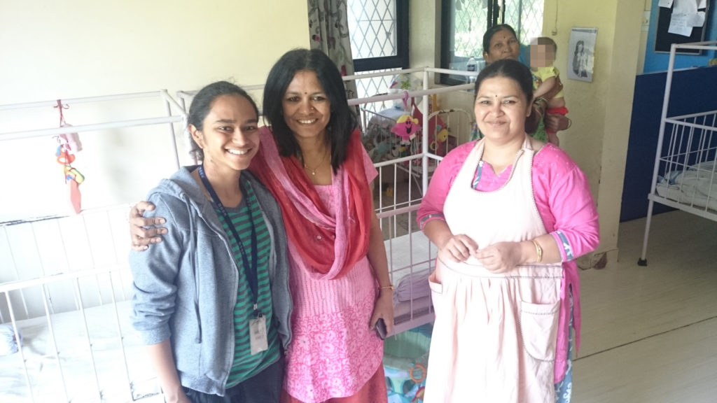 Shabana poses for a picture with staff members at BSSK, the orphanage in Pune where she lived before coming home to her family.