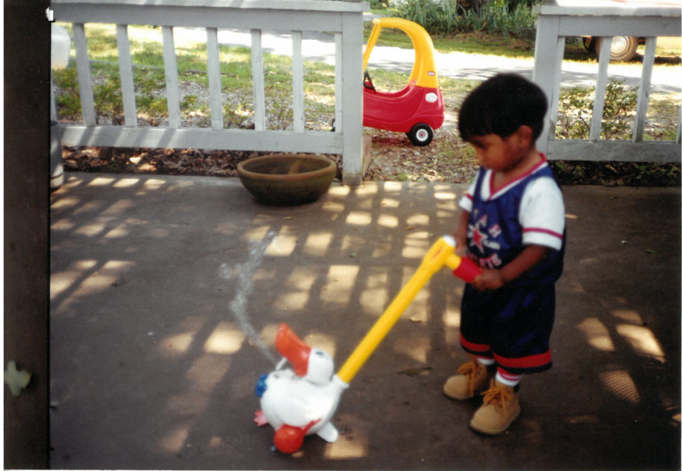 Phillip at home in Arkansas, playing with a toy Char gave him.