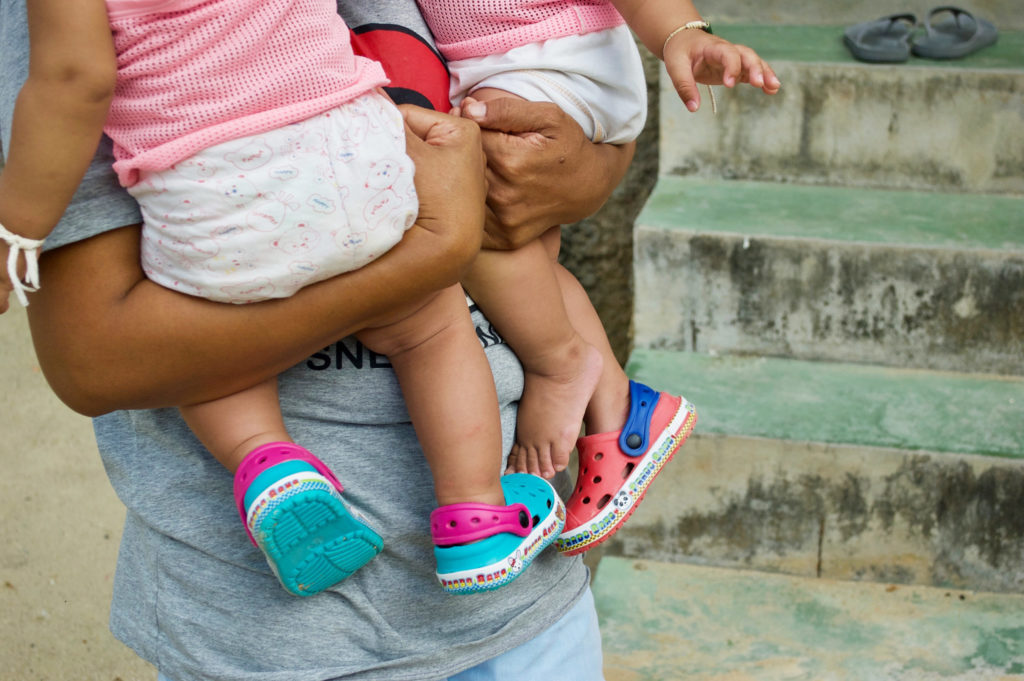 Ping holding both of her sons.