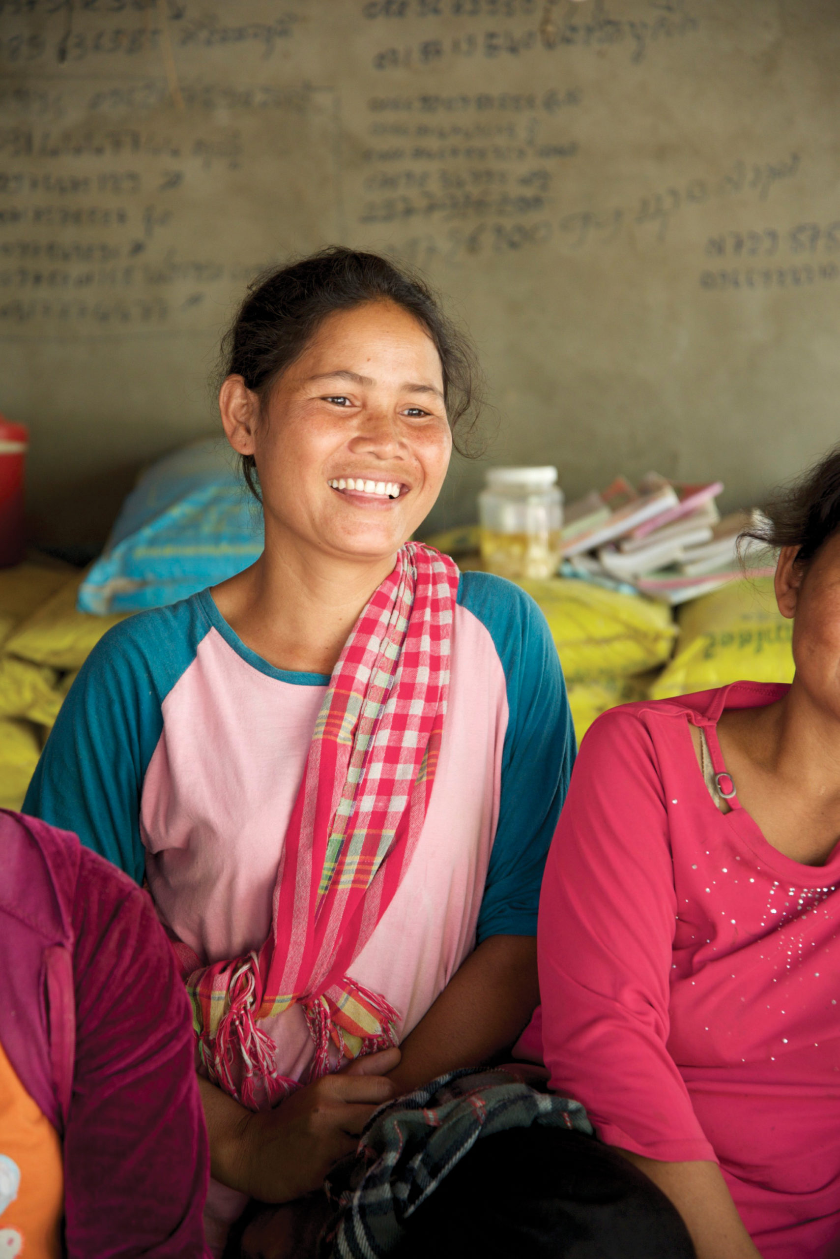 Yai, a mother, smiling. Cambodia sponsorship helps care for her family and her children's education.