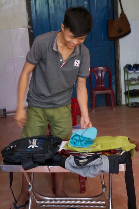 Van Dai packs his belongings into a single backpack. This is all he will bring with him to the U.S.