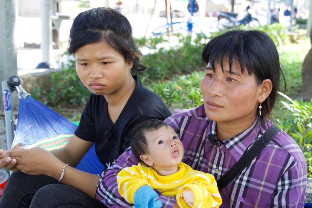 Linh, her mom and Linh's newborn baby. 