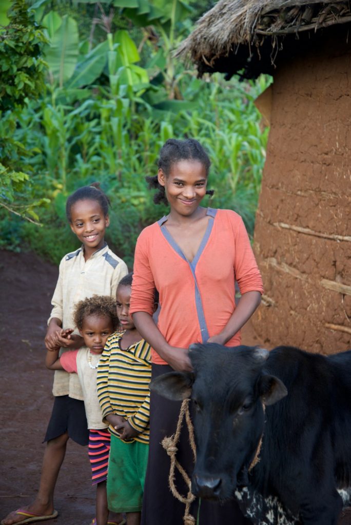Meselech with her children and the cow she received as a Gift of Hope.
