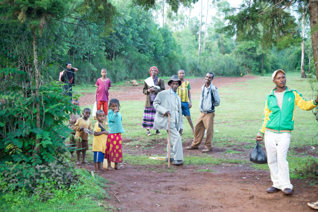 People gather to greet us as we visit families in this village. Through the years, Holt donors have given many GIfts of Hope to families and children in this community.