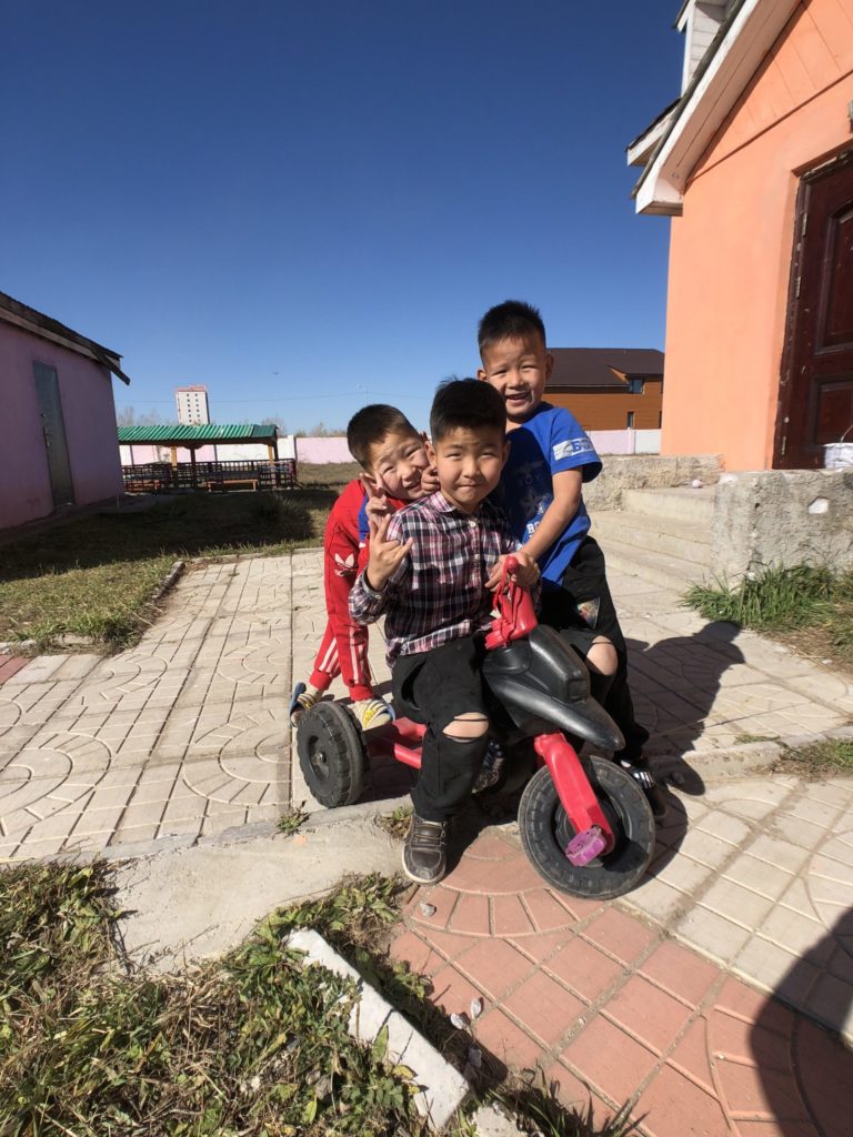 Children playing outside at Mongolia's Sun Child Orphanage. 