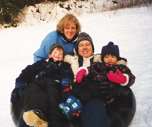 A young Mai Anh with her adoptive family in the snow. 