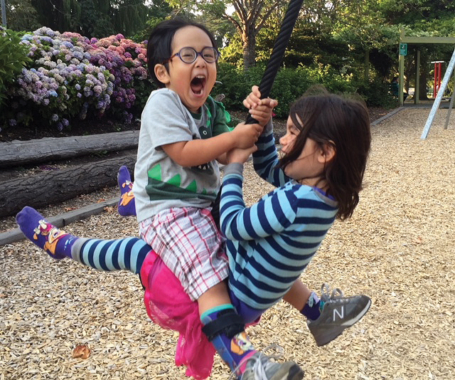 Taeyang plays on a rope swing with his sister. 