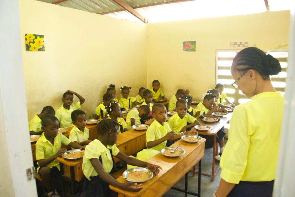 Sponsored kids eating lunch at Fontana Village School in Haiti. 