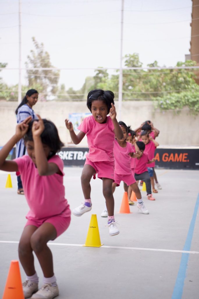 Every Friday, a class of children goes to a nearby sports facility for games and physical education. 