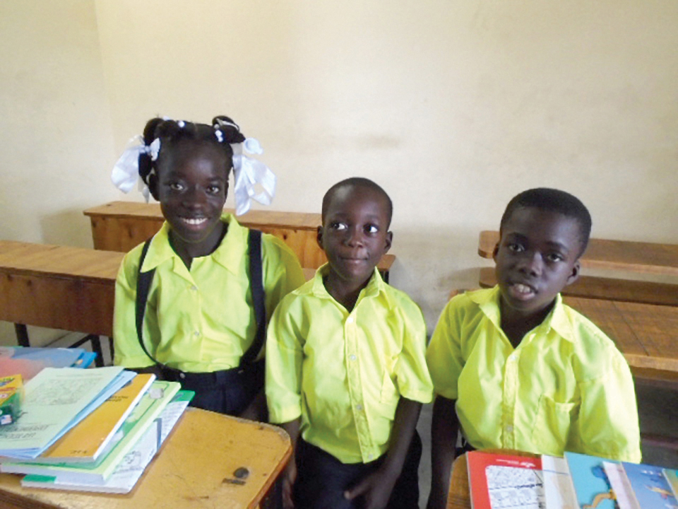 Fritz (center) with his classmates at Fontana Village School.