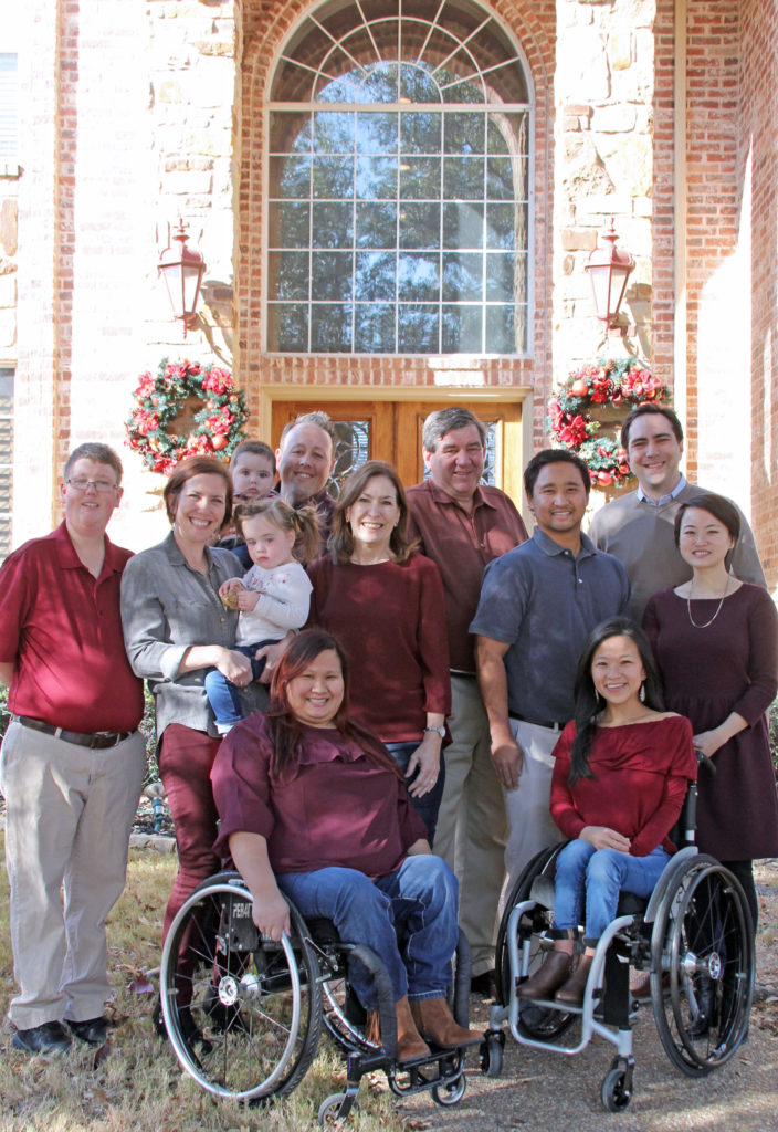 Amy (right, front) with her mom (center) and family.