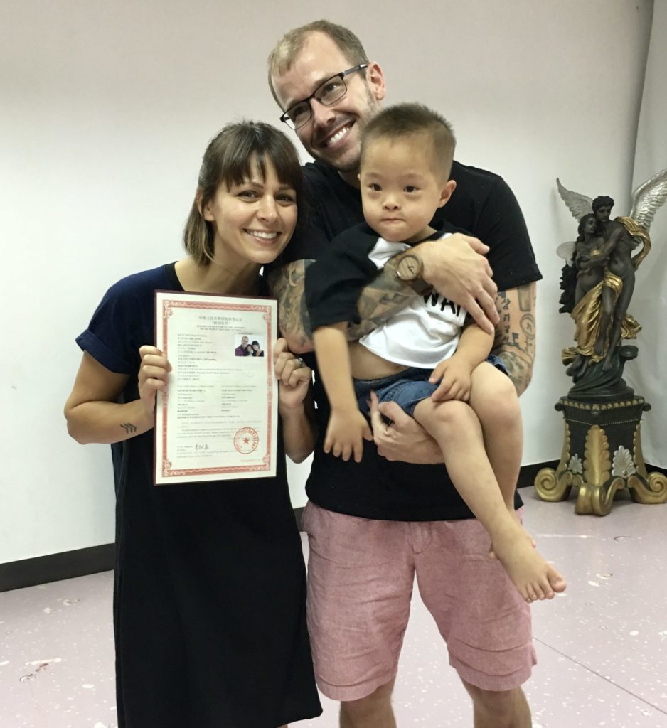 Micah with his parents on their adoption day in China. 