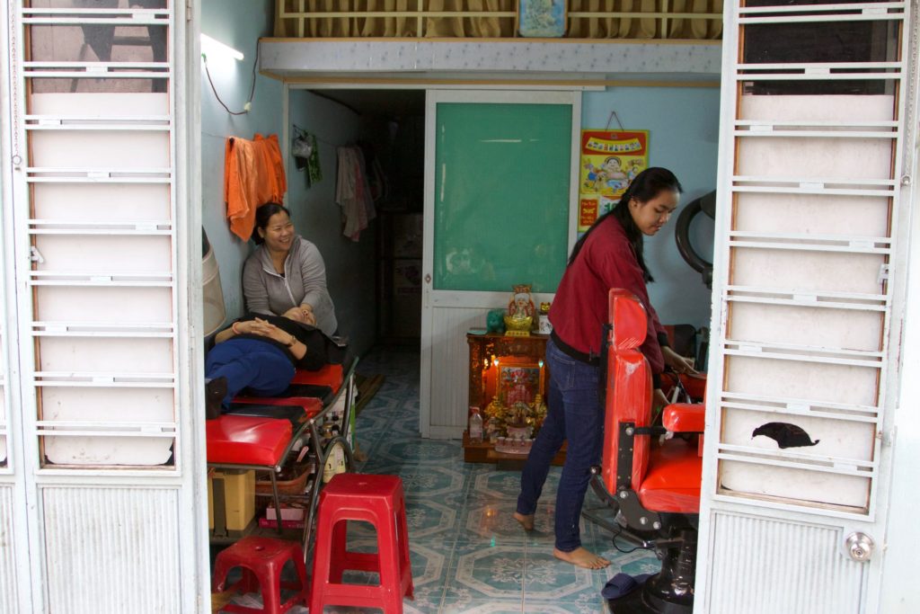 Vieng's hair salon that began with the small microloan microloan she was gifted.