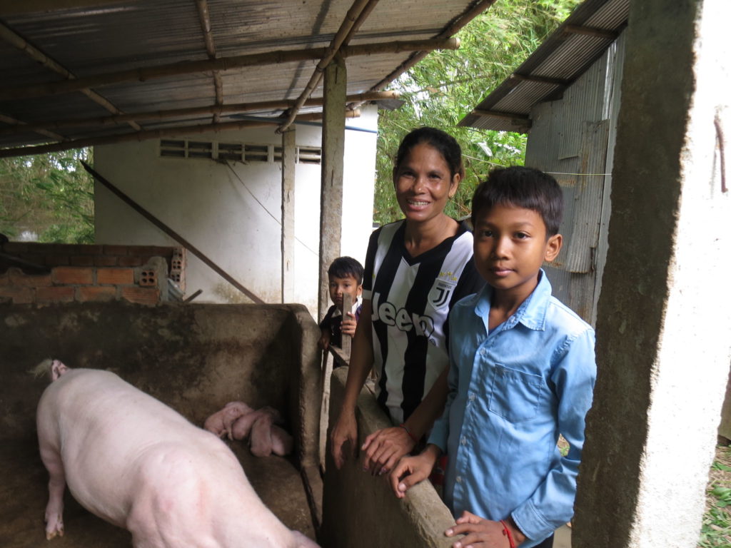 Mol Vey’s family with their pig.