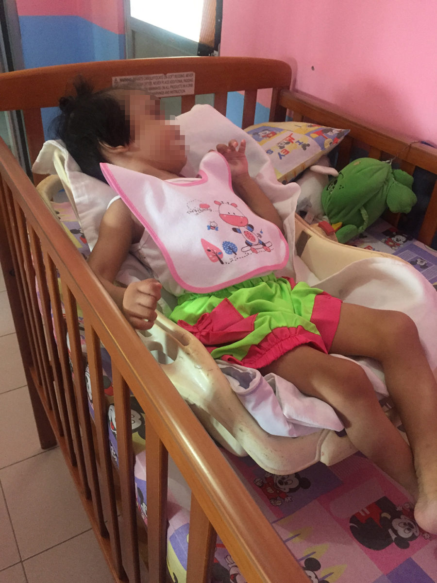 Analyn in her crib.