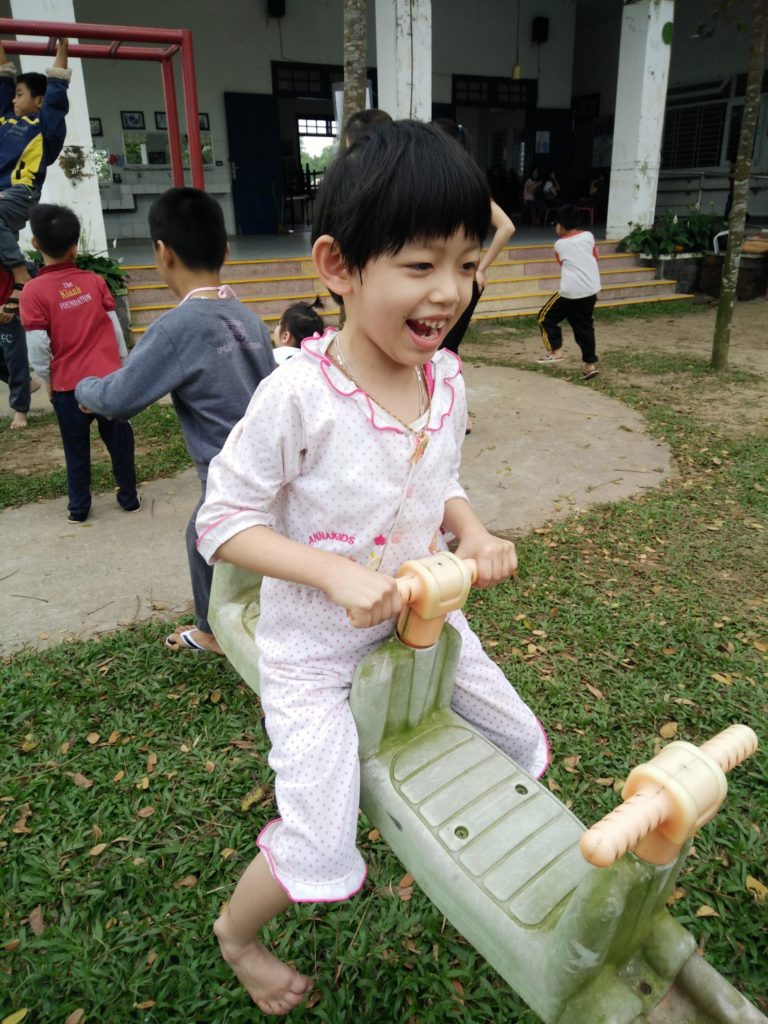 Vuong plays on the playground at school.