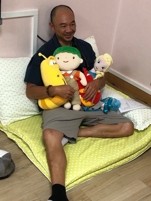 While visiting the orphanage where he lived as a child in Korea, caregiver Sister Theresa sat him down in the children's play area and piled stuffed animals on him. Joah says it was the highlight of his visit. 