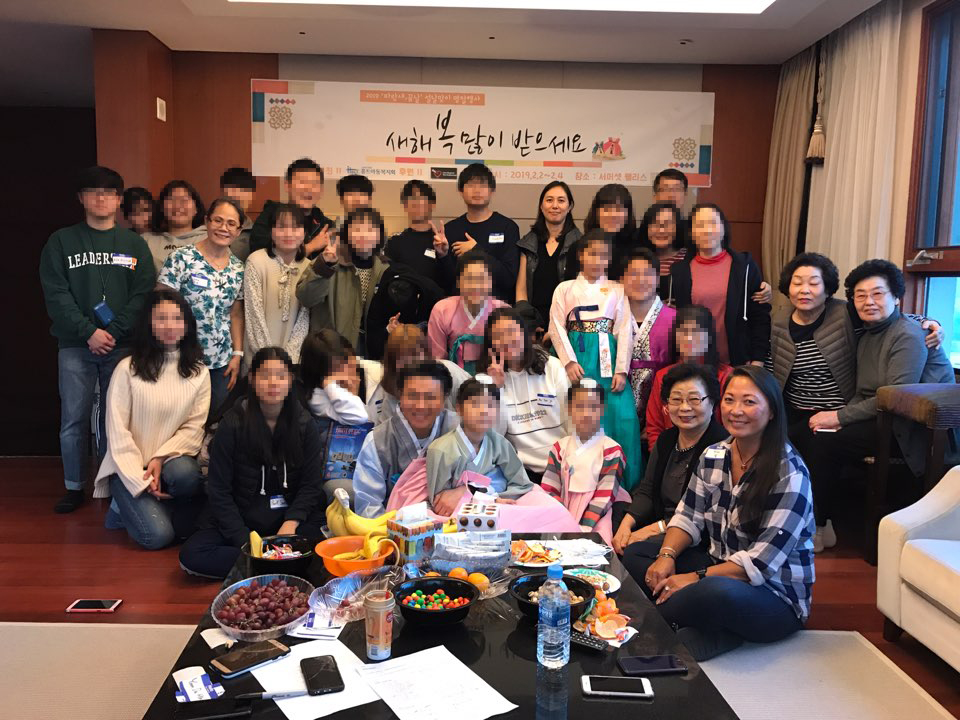 Julie and Kim with the aged-out orphans who participated in this year's Lunar New Year event. To protect their privacy, we've blurred the photos of the aged-out orphans.