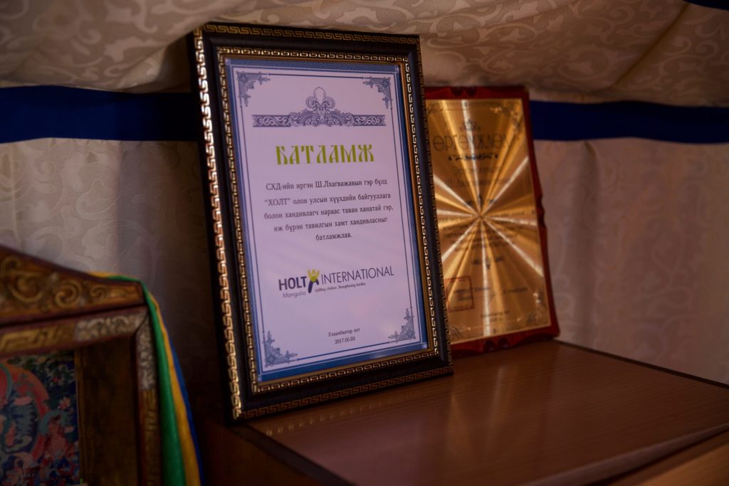 After receiving a ger as a Gift of Hope, the family displayed their certificates of ownership inside their new home. 