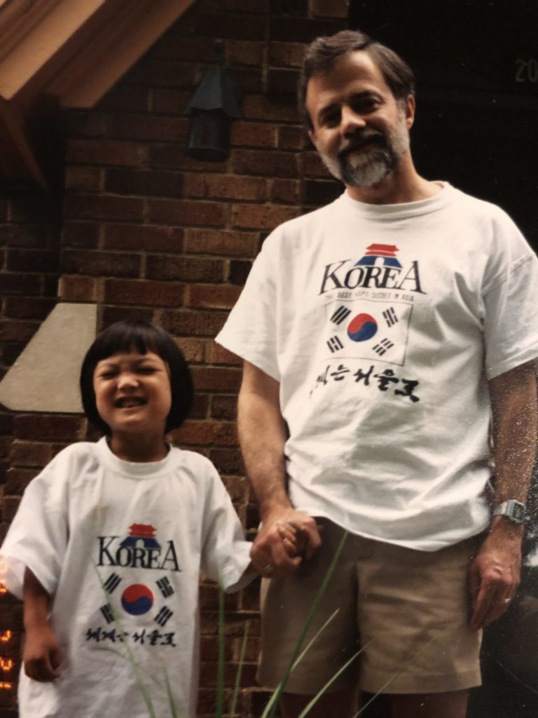 A photo of Kim and her father, Mike, in Korea t-shirts, which appeared in the Holt magazine in 1996.