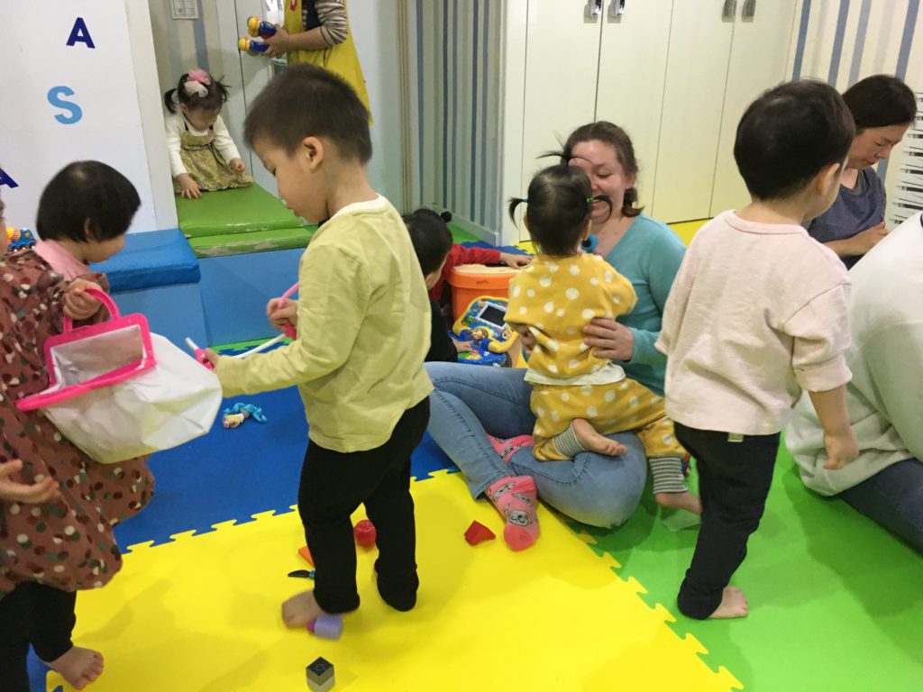 Gift team participants play with children in one of Holt's programs in Korea. 